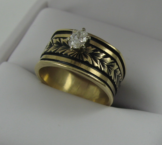 Appraisal: DIAMOND AND FOURTEEN KARAT GOLD RING set with an oval-cut