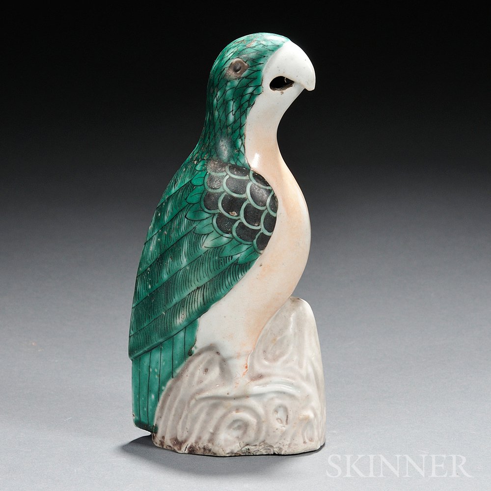 Appraisal: White Porcelain Parrot China standing on a rock with details