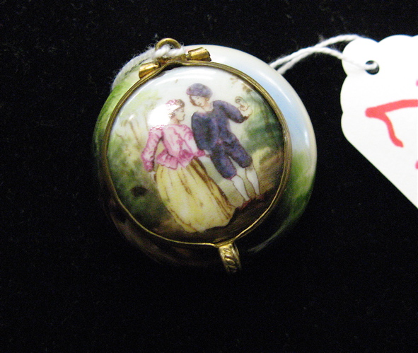 Appraisal: A FRENCH ENAMELED MINIATURE ROUGE BOX hand painted courting couple