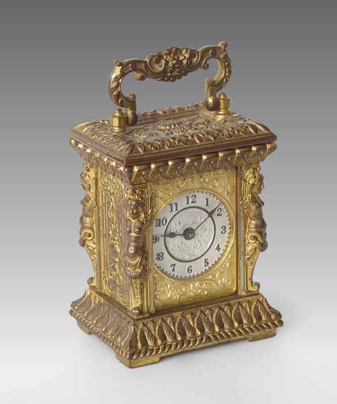 Appraisal: GILT ANSONIA COMET FIGURAL CARRIAGE CLOCK Cast metal case with