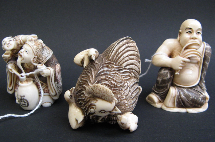 Appraisal: THREE CHINESE HAND CARVED IVORY PIECES a netsuke in the