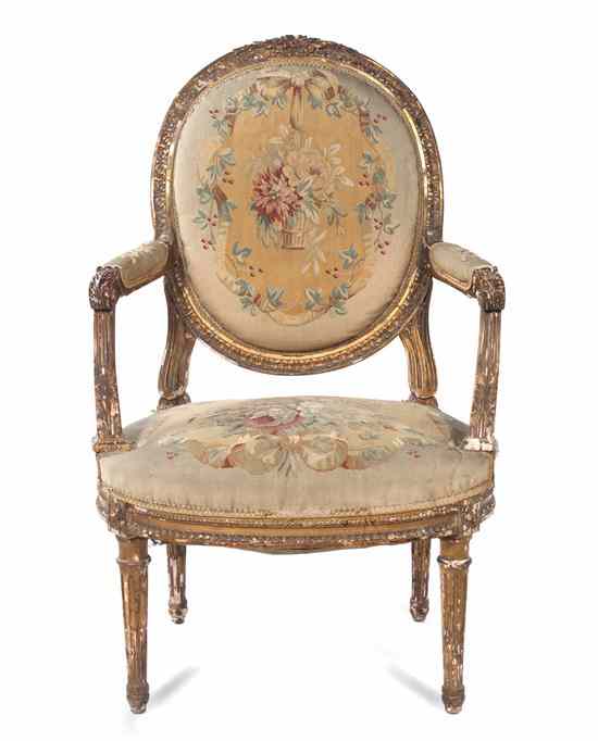 Appraisal: A Louis XVI Style Giltwood Fauteuil having a foliate carved