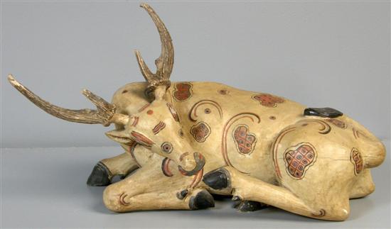 Appraisal: Indian carved and painted wood figure of a deer th