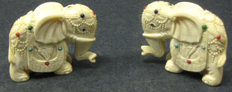 Appraisal: PAIR OF INDIAN IVORY ELEPHANTS Each finely carved inset with