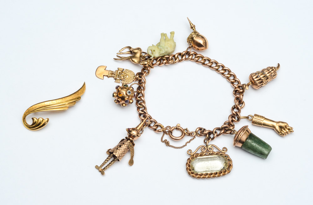 Appraisal: CT GOLD CHARM BRACELET PIN To include an K yellow