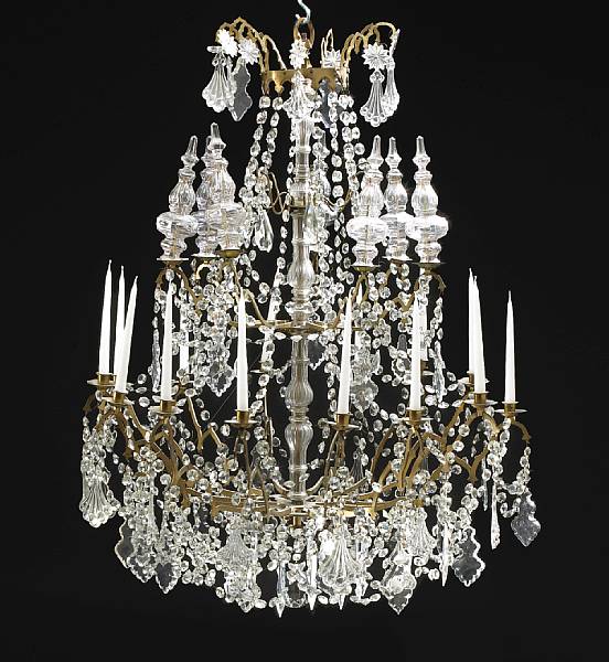 Appraisal: An Italian gilt bronze iron and glass fourteen light chandelier