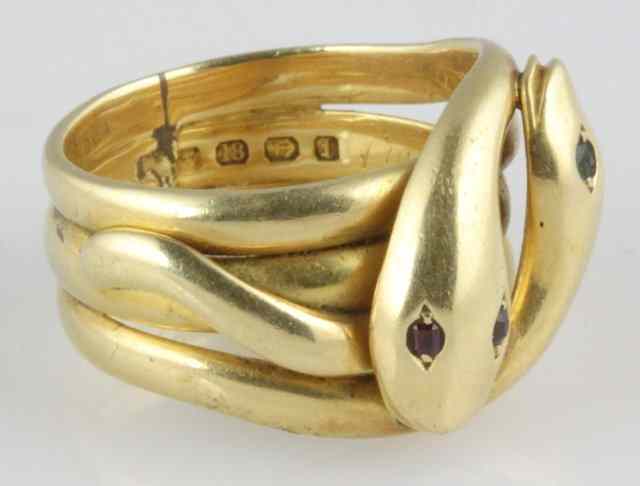 Appraisal: An ct gold gem set Masonic ring intertwined snakes with