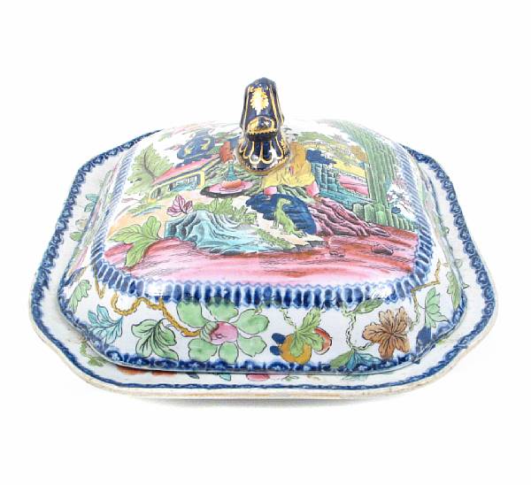 Appraisal: An English ironstone transfer decorated and painted covered vegetable dish