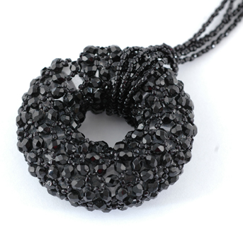 Appraisal: An Italian glass and black bead pendant The circular clear