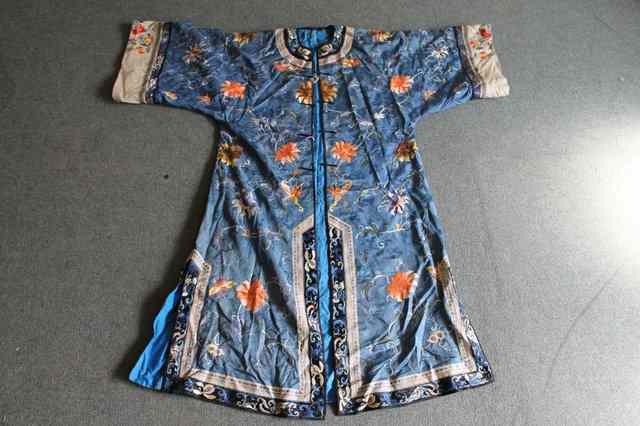 Appraisal: A CHINESE LIGHT BLUE SILK ROBE with blue silk lining