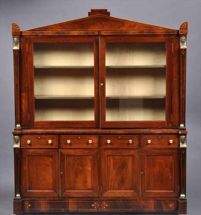 Appraisal: REGENCY INLAID ROSEWOOD AND GRAINED BOOKCASE The pediment with anthemia