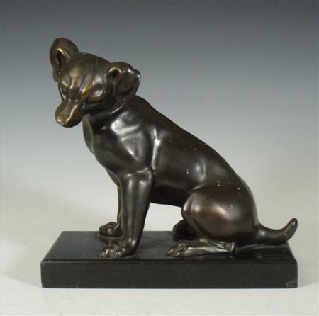 Appraisal: A th century patinated bronze figure of a dog sitting