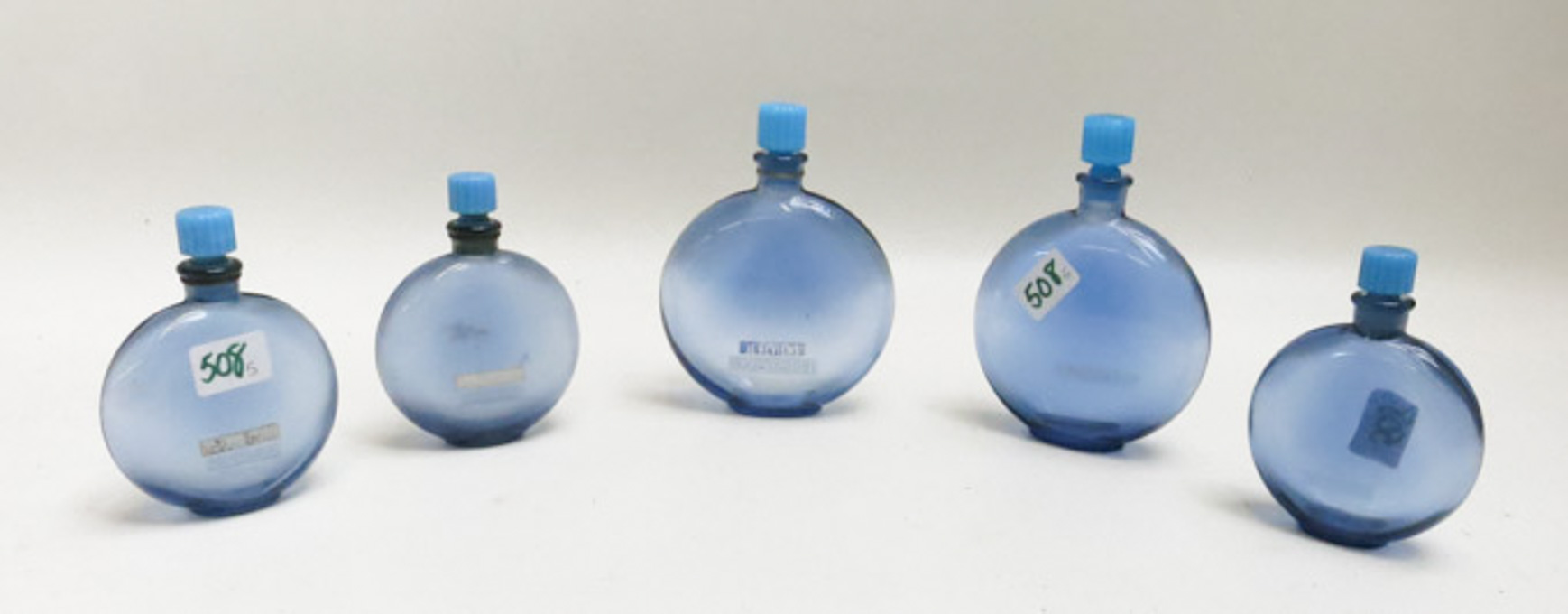 Appraisal: FIVE RENE LALIQUE BLUE GLASS PERFUME BOTTLES made for Worth's