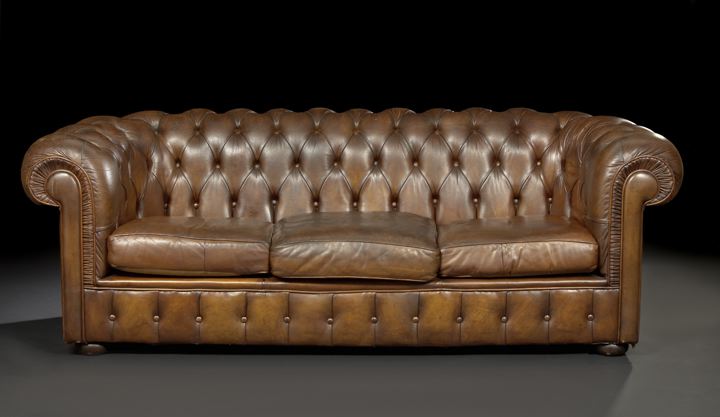 Appraisal: Edwardian Mahogany and Leather-Upholstered Chesterfield Sofa early th century the