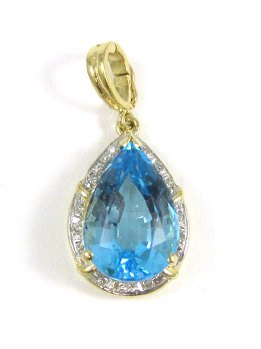 Appraisal: BLUE TOPAZ AND DIAMOND PENDANT The k yellow and white