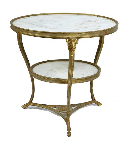 Appraisal: A pair of Empire style bronze and marble topped tables