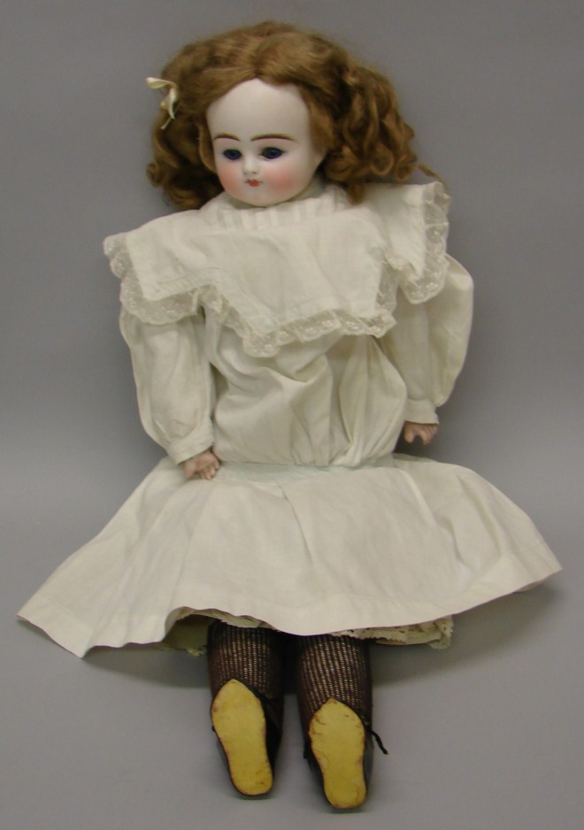 Appraisal: Solid dome unmarked turned shoulderhead doll Possibly ABG or Kestner