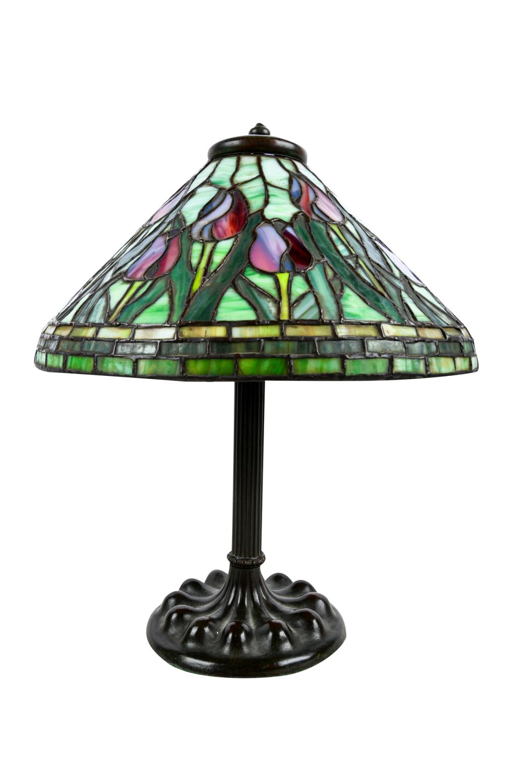 Appraisal: LEADED GLASS TABLE LAMPunsigned shade on bronze base Condition glass