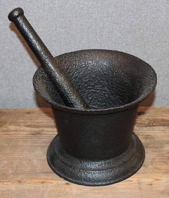 Appraisal: AN OLD BLACK PAINTED CAST IRON MORTAR with matching pestle