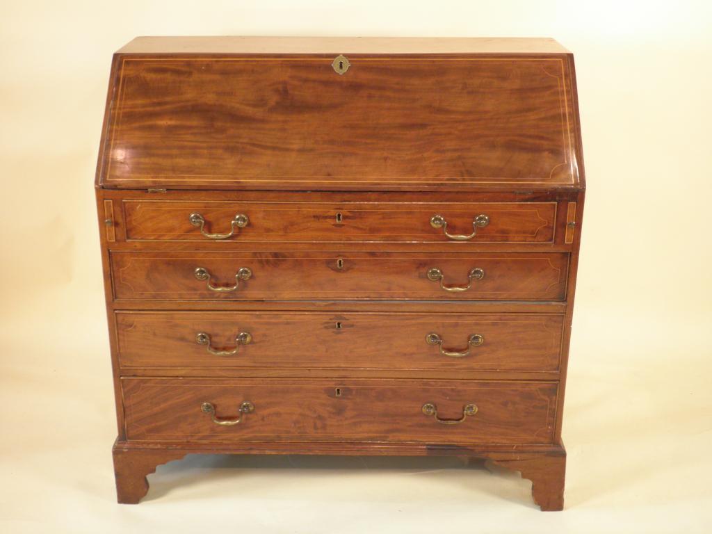 Appraisal: A George III mahogany boxwood strung bureau the fall with