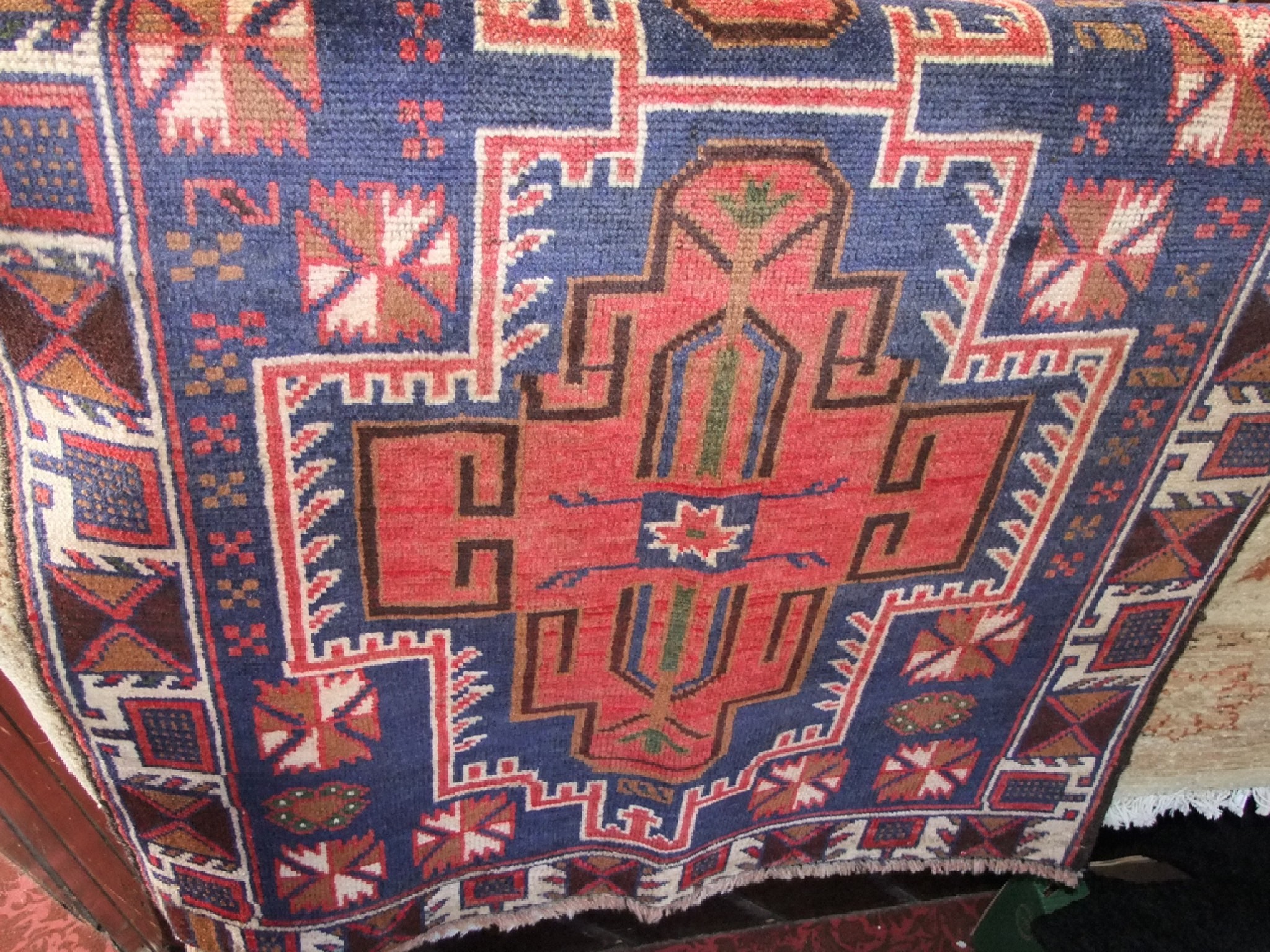 Appraisal: An old Balochi wool rug the navy blue ground with