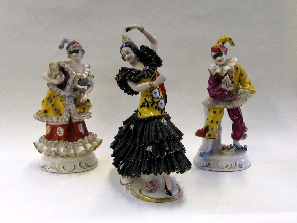 Appraisal: Pair of continental figures of a male and female harlequin