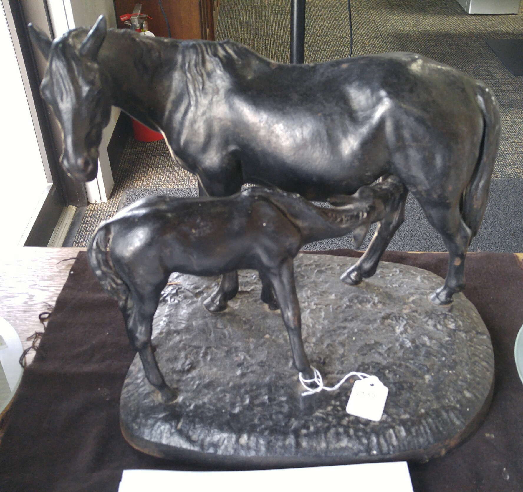 Appraisal: CAST IRON FIGURAL GROUP OF TWO HORSES Russian dated Grown