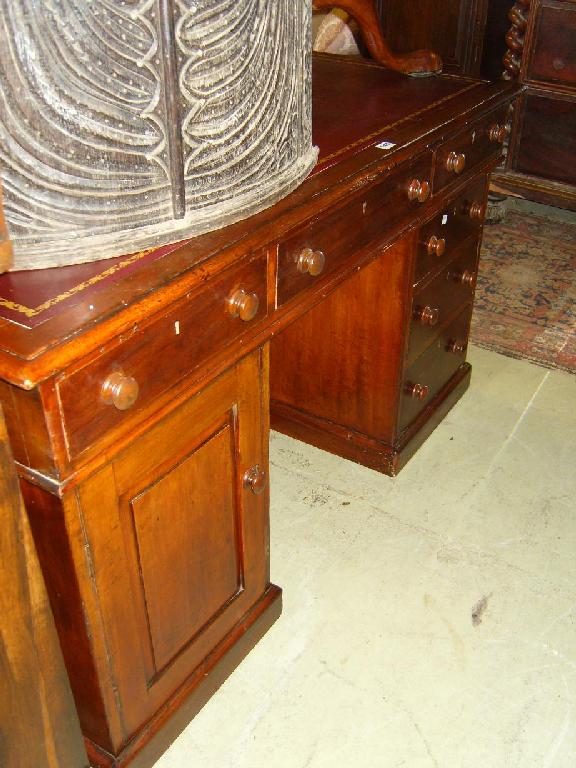 Appraisal: A Victorian mahogany kneehole partners desk fitted with an arrangement