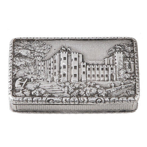 Appraisal: A Victorian silver 'castle top' snuff box the lid relief