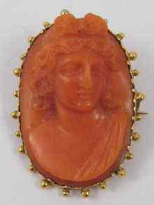 Appraisal: A th c carved coral cameo brooch approx cm