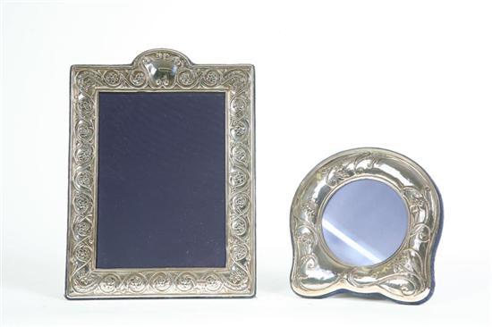 Appraisal: TWO STERLING PICTURE FRAMES One in the shape of a