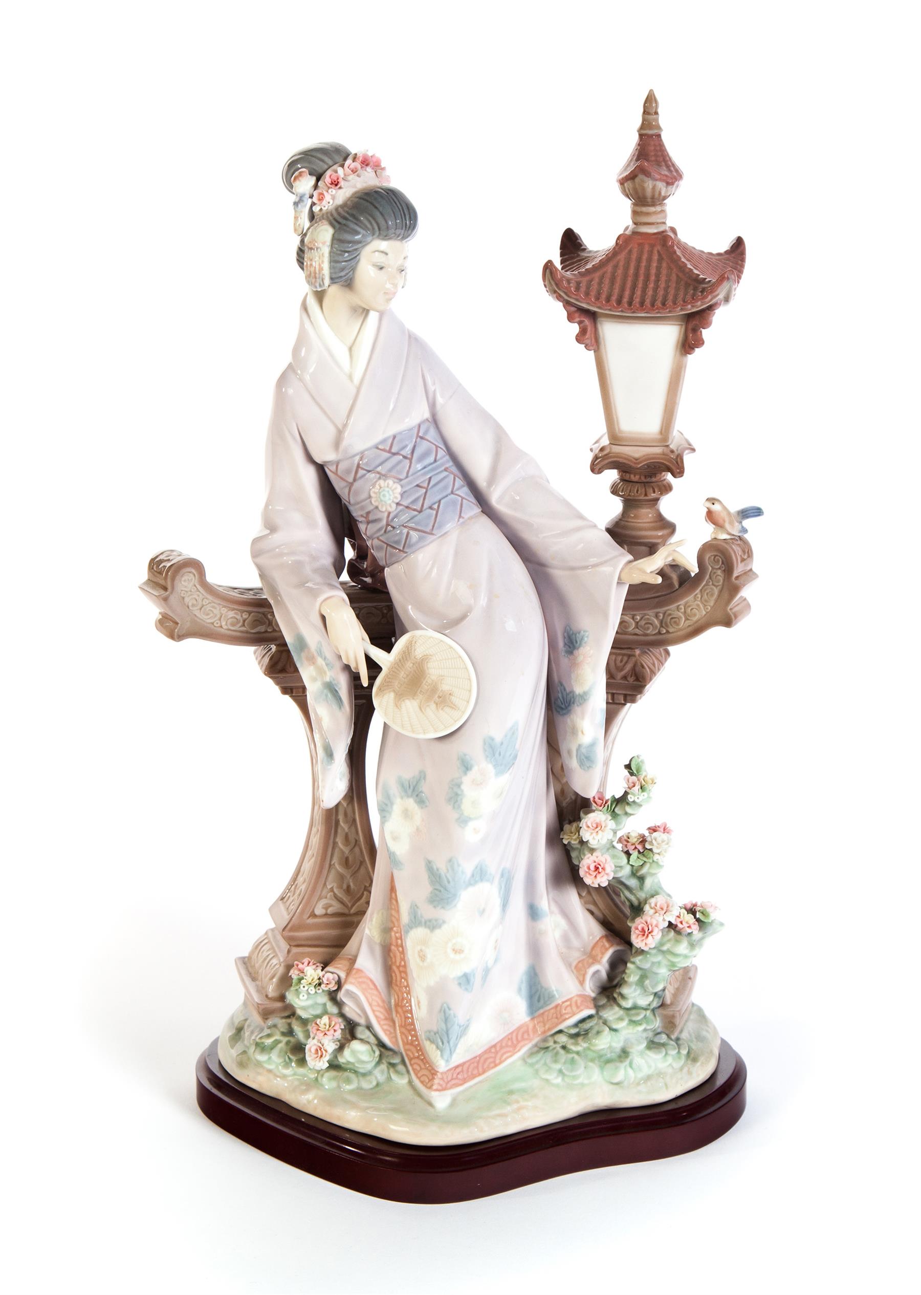 Appraisal: LLADRO OF ASIAN WOMAN IN A GARDEN ON WOODEN PLINTH