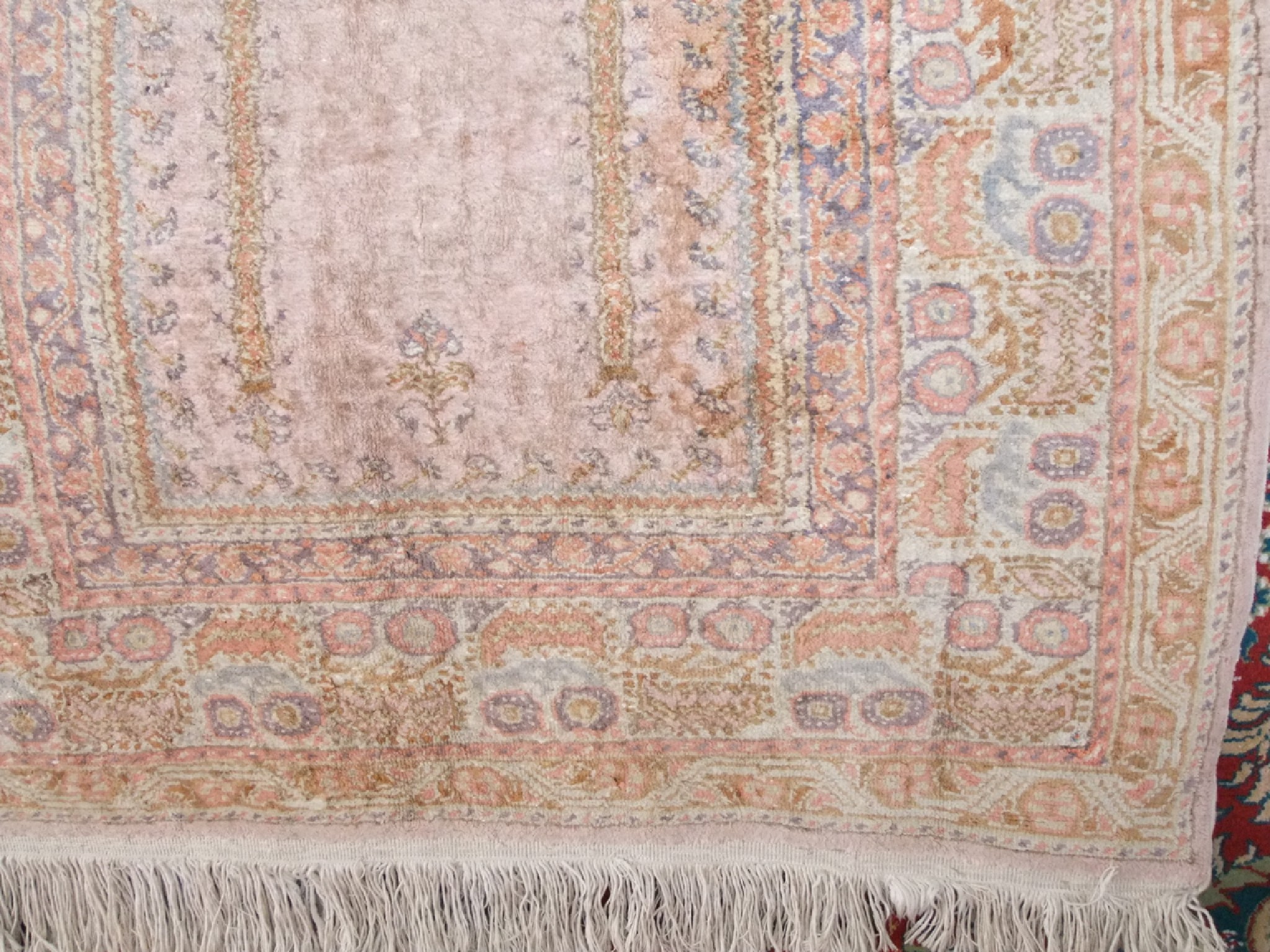 Appraisal: A small woven eastern rug with geometric decoration in shades