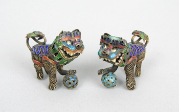 Appraisal: A Pair of Miniature Enamel Foo Dogs Chinese A very