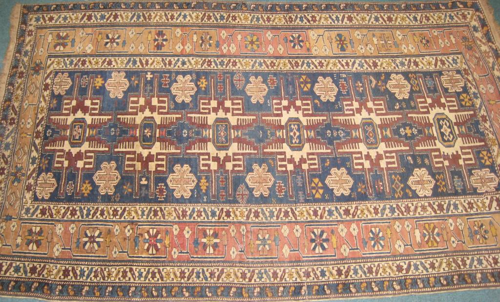 Appraisal: An old Kazak type bordered Rug with stylized rosette design