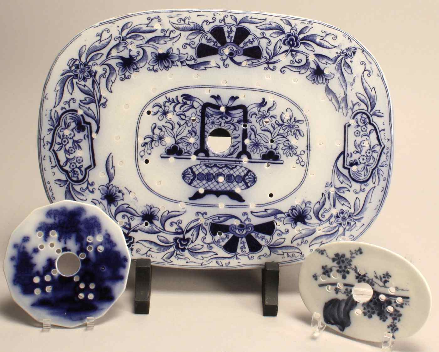 Appraisal: THREE FLOW BLUE RETICULATED LINERSEnglish th CenturyOne for a platter