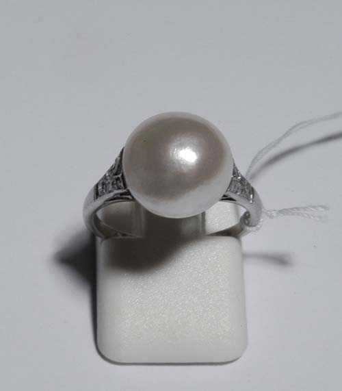 Appraisal: PEARL AND DIAMOND RING ca Platinum Classic ring set with