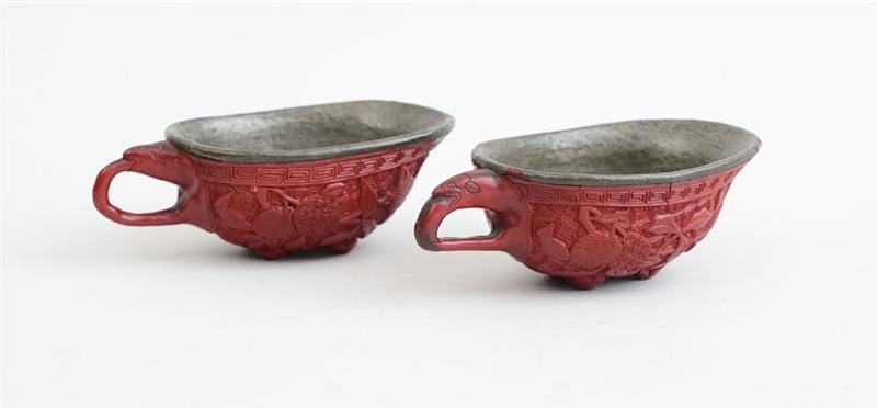 Appraisal: PAIR OF CHINESE CINNEBAR LACQUER CUPS IN AN ARCHAIC STYLE