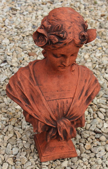 Appraisal: A CAST TERRACOTTA COLOURED ART NOUVEAU STYLE BUST of a