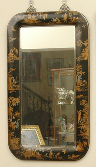 Appraisal: A CHINOISERIE BLACK LACQUERED WALL MIRROR The bevelled rectangular plate