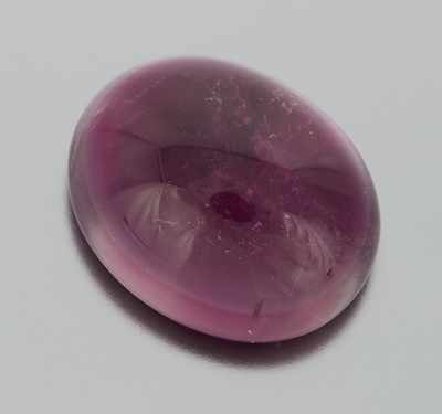 Appraisal: An Unmounted Rubellite Cabochon Carat Cabochon cut weighting ct