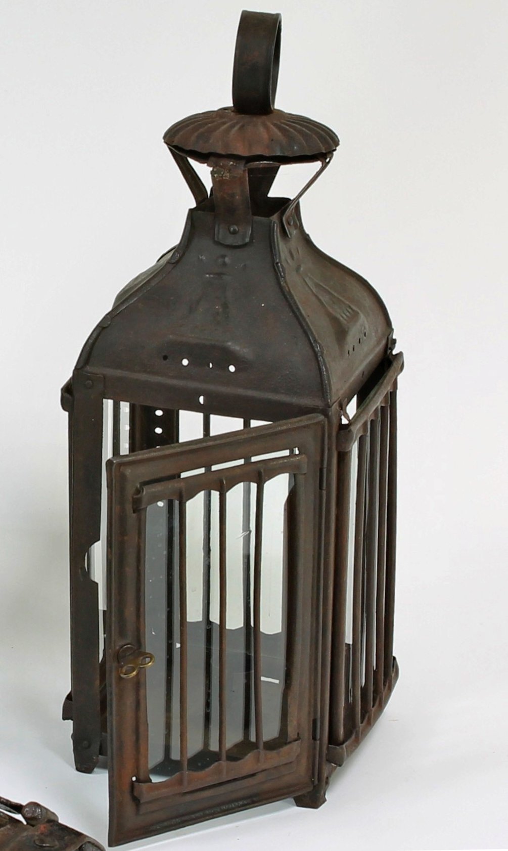 Appraisal: An early th Century iron and glass candle lantern with