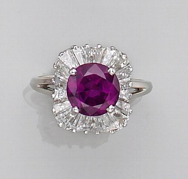 Appraisal: of ballerina design centering a circular-cut ruby surrounded by baguette-cut