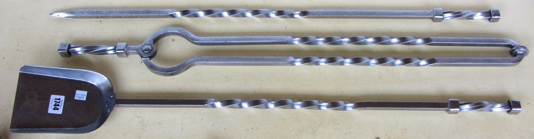 Appraisal: A set of three steel fire irons with square spiral