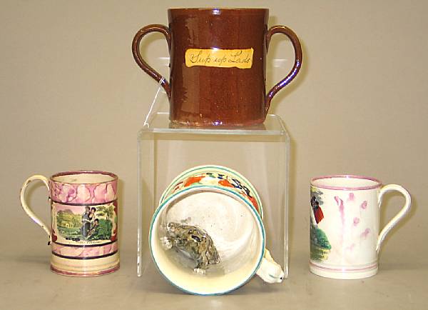 Appraisal: Four Staffordshire pottery frog mugs th early th century Comprising