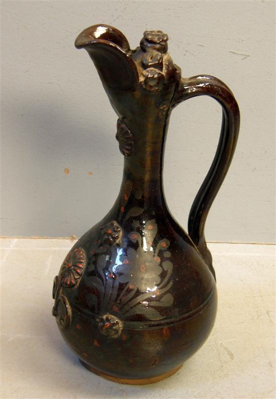 Appraisal: English pottery purple lustre jug with applied floral decoration h