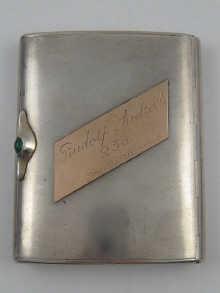 Appraisal: A Russian silver cigarette case with green cabochon thumbpiece box