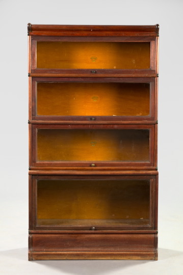 Appraisal: American Macy Mahogany Four-Section Stacking Bookcase ca the base with