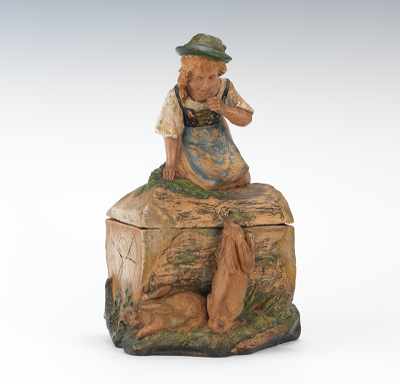 Appraisal: A Figural Humidor with a Young Girl Regarding Rabbits From