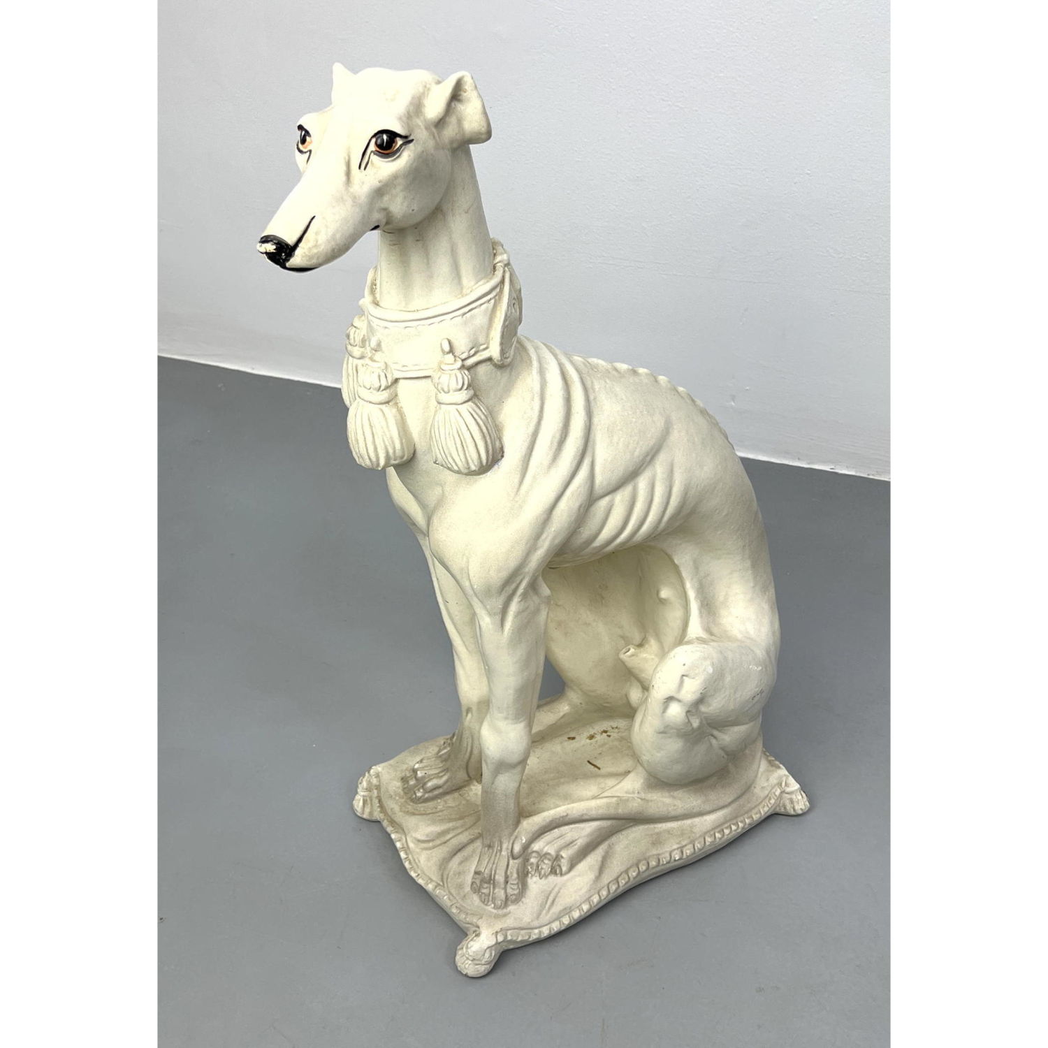 Appraisal: Plaster Sculpture of Seated Dog on Pillow Greyhound Whippet Dimensions